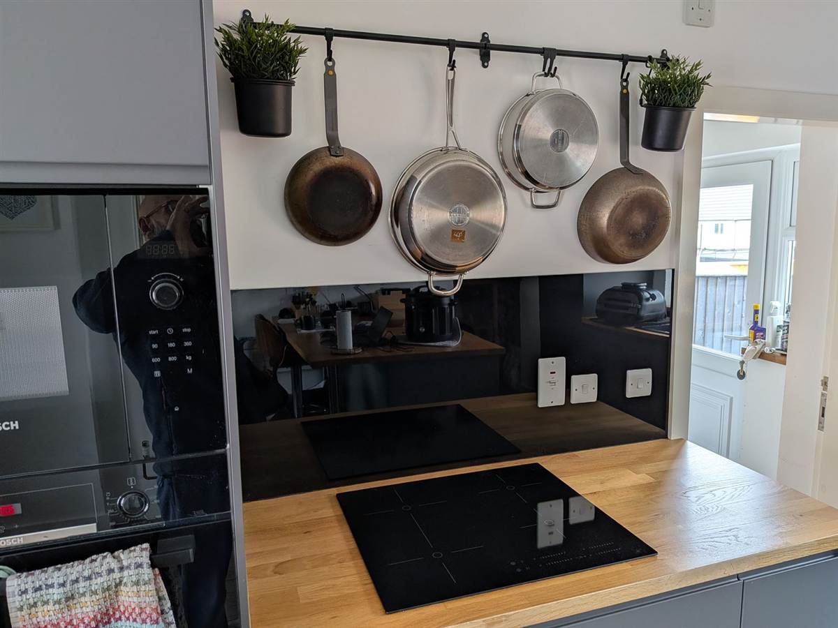 After — induction hob and overhead pan rack